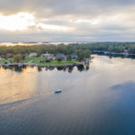 An aerial image of Lake Murray with a scenic sunset and small peninsula of houses in the Central SC Region