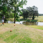 A golfer swings at a tee at a golf course in Calhoun County in Central SC